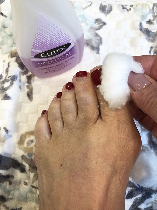 Using a cotton ball to take off nail polish
