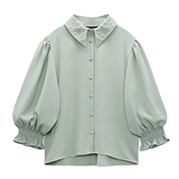 Green top with embellished collar.