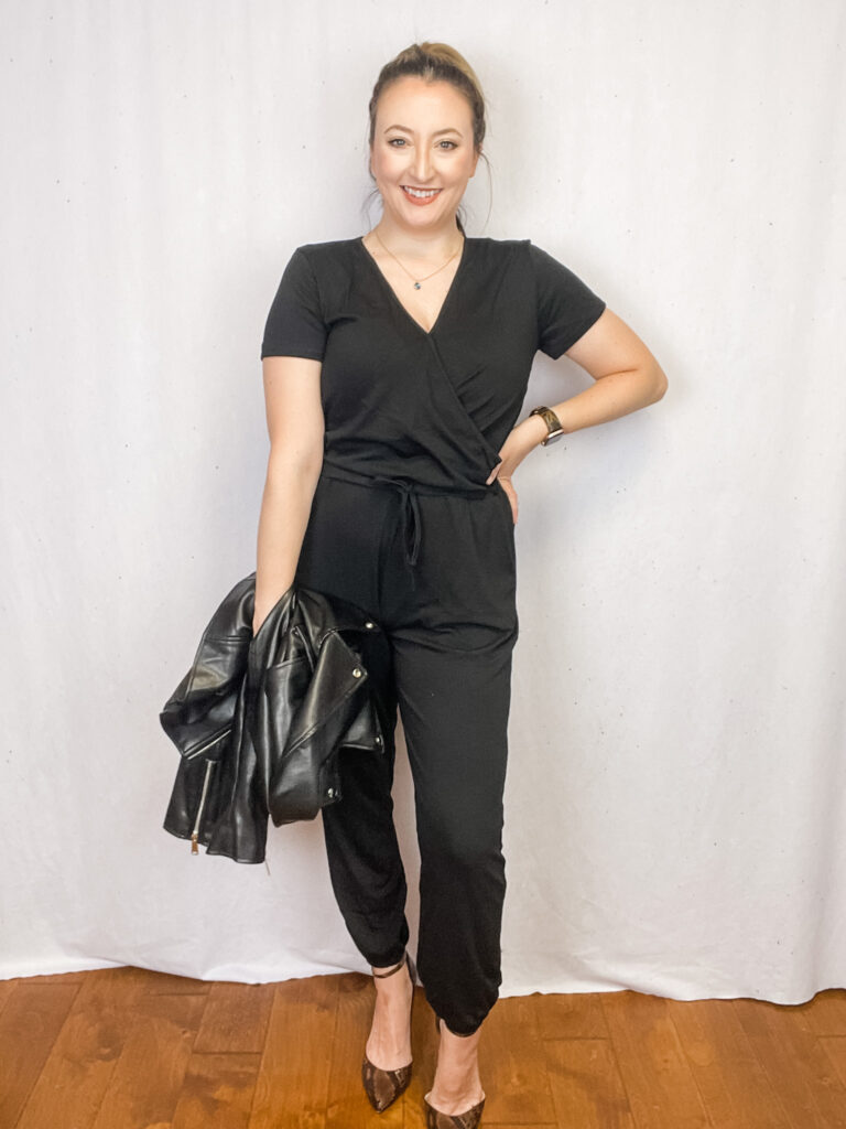 Women wearing black jumpsuit with black leather jacket.