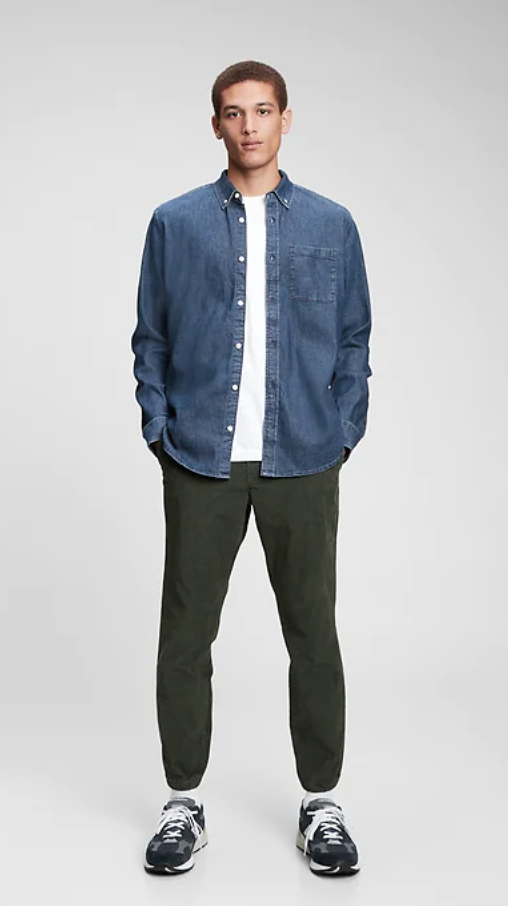 Man wearing denim shirt.
