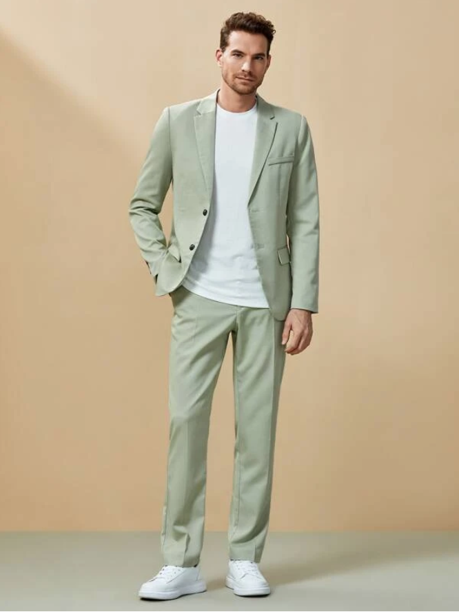 Man wearing green suit, part of men's spring fashion for 2022.