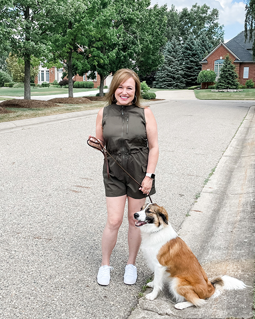 Woman walking cute dog.