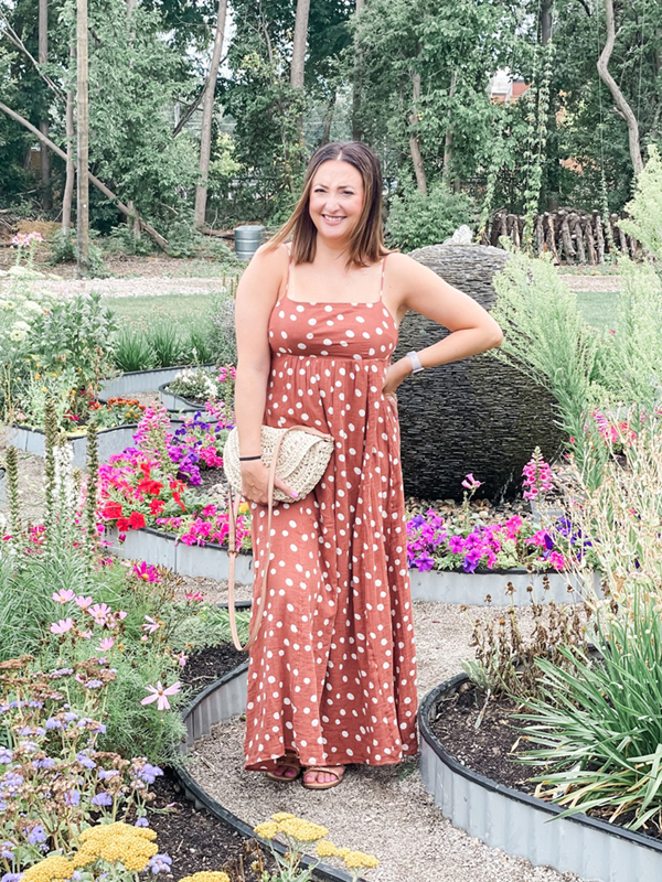 Woman wearing brown polka dot dress