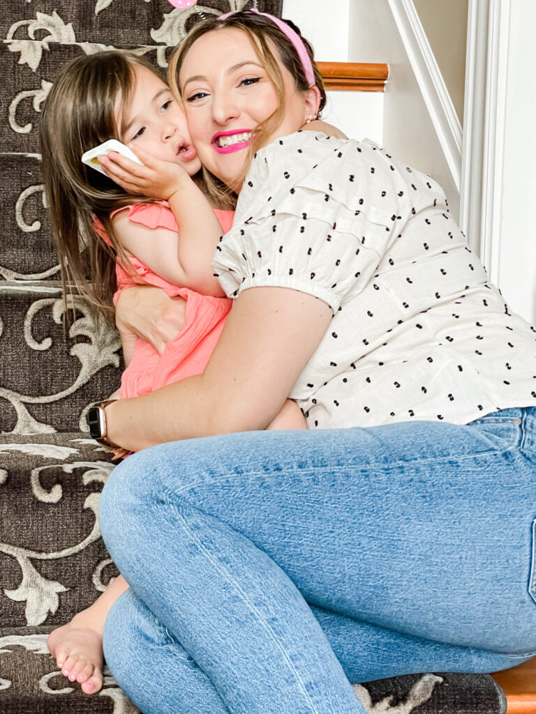 woman wearing barbiecore pink lipstick with daughter