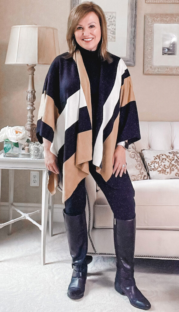 Woman wearing a color block poncho ruana
