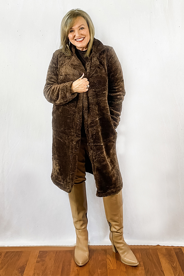 Woman wearing fuzzy brown coat