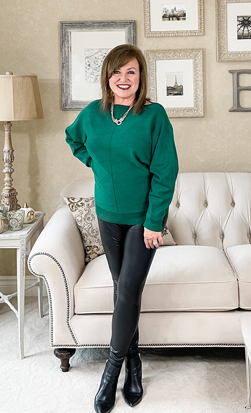 Woman wearing forest green sweater