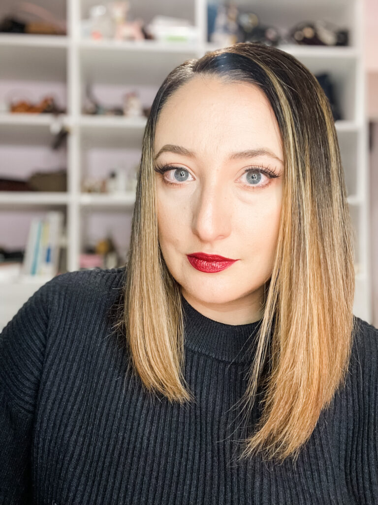 Woman modeling dark lipstick