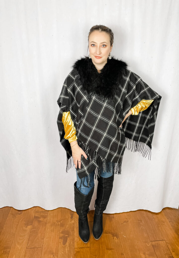 how to wear it at any age woman wearing plaid cape with faux fur
