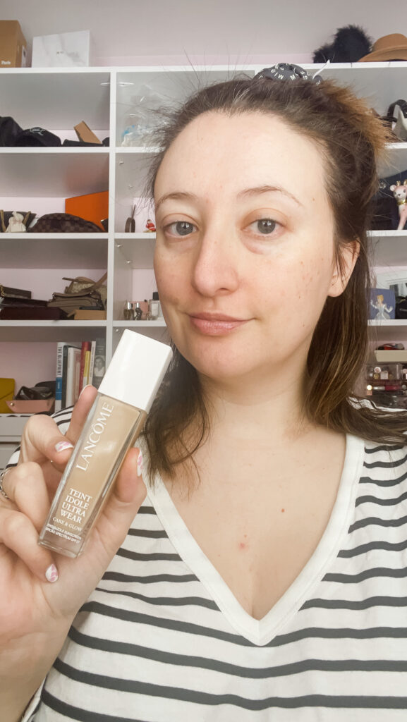 Woman showing how to apply foundation
