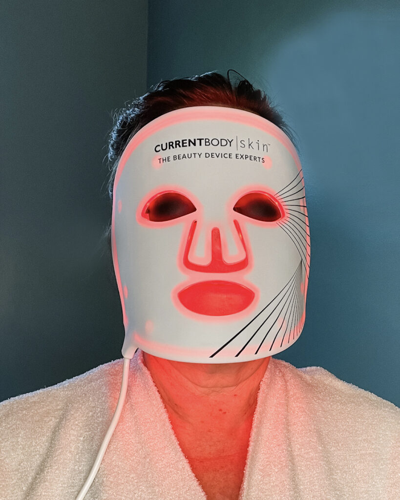 Woman doing red light therapy at home