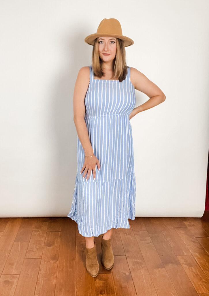 Woman wearing blue and white striped dress